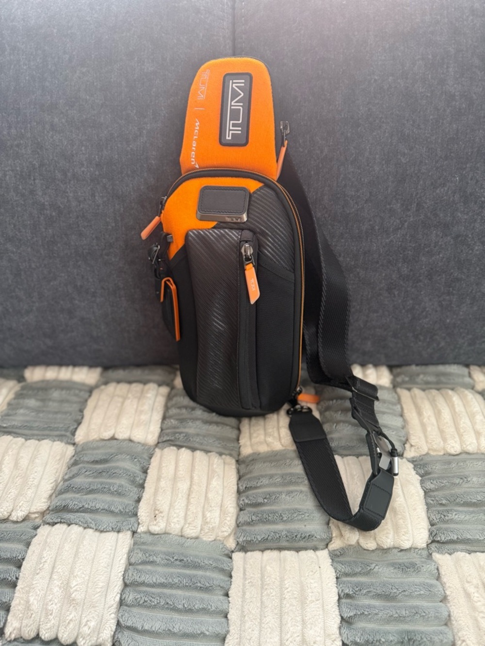 TUMI means Sling Mclaren Edition. Only used once